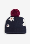 Bonnet fleuri bébé fille bleu marine en tricot Catimini