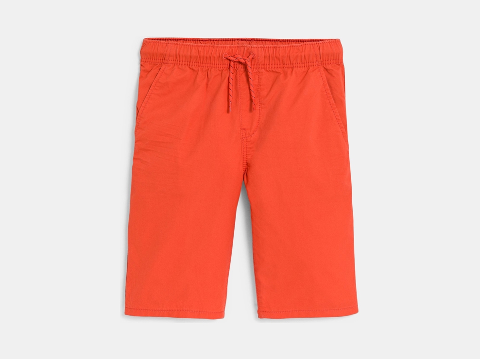 Bermuda met smalle pijpen van effen blauwe stof voor jongens 1