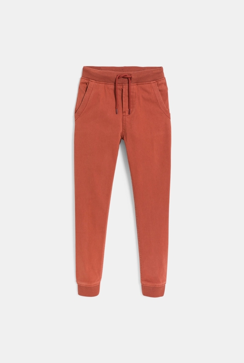 Pantaloni jogpant tinta unita arancio in tela elasticizzata per bambino 1