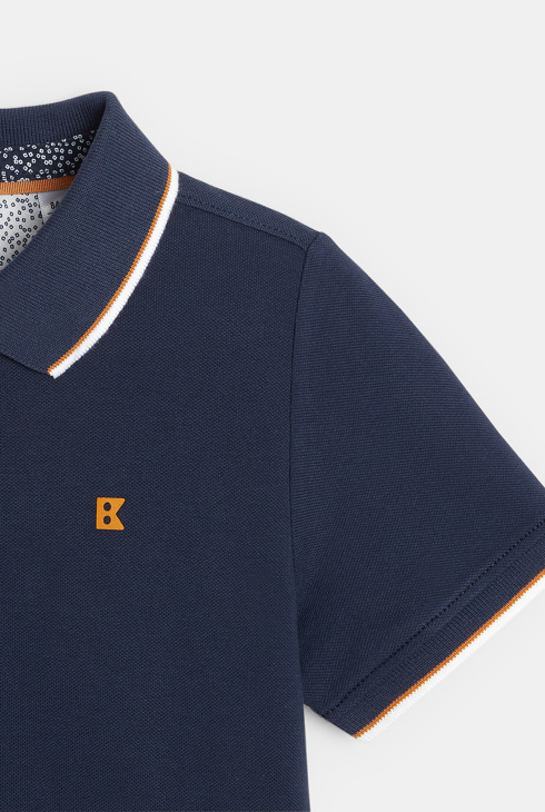 Polo piqué col couleur bleu garçon