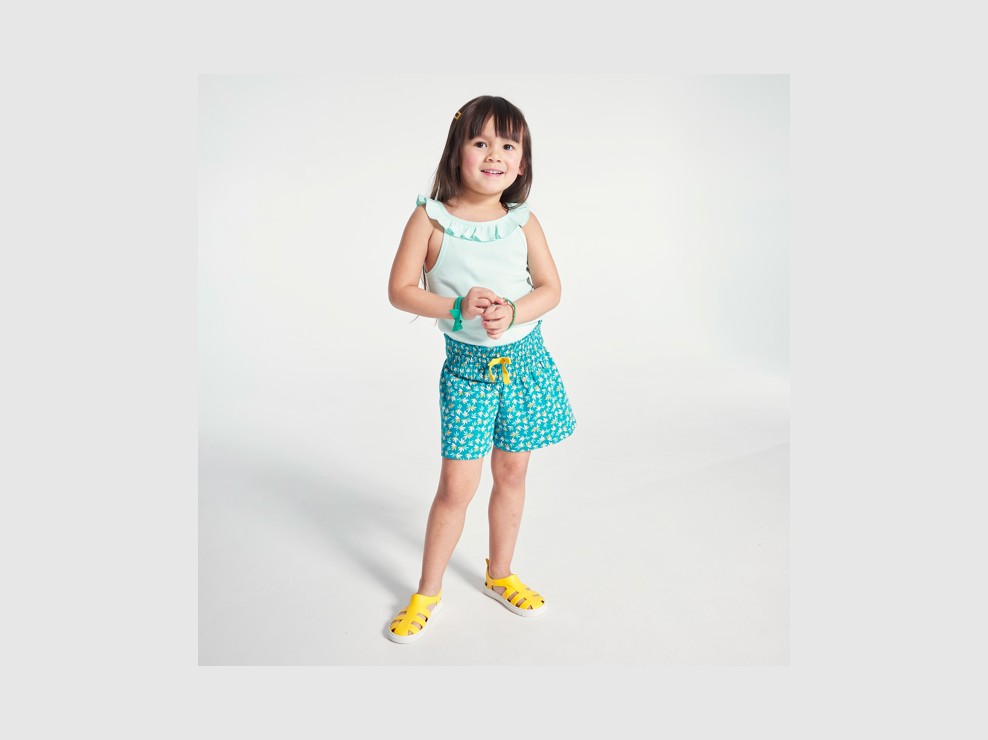 Débardeur uni à col volanté bleu fille 1