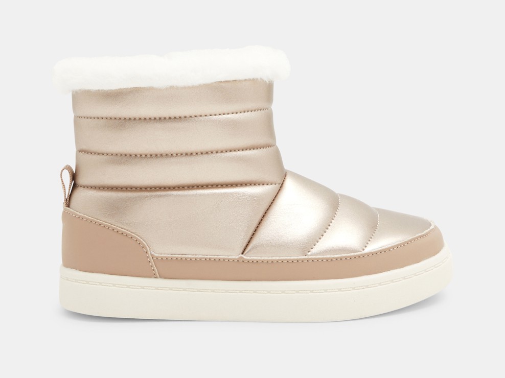 Boots brillantes fourrées effet matelassé or fille 1