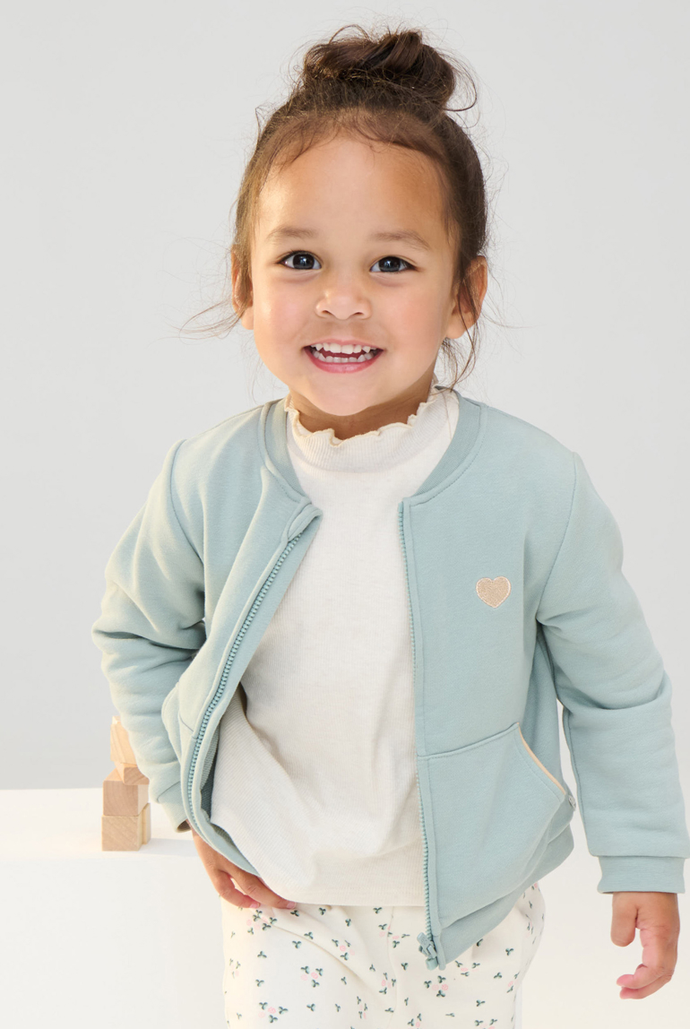 Sudadera muletón con cremallera parche corazón verde bebé niña 1