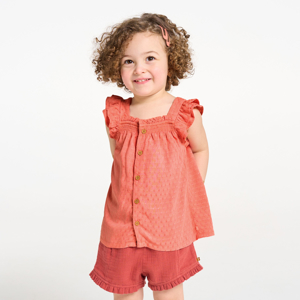 Baby girl's pink plumetis cotton strappy blouse. 1