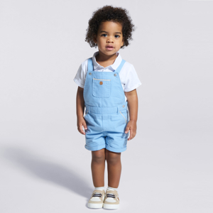 Baby boy's blue short dungarees and white piqué polo shirt 1