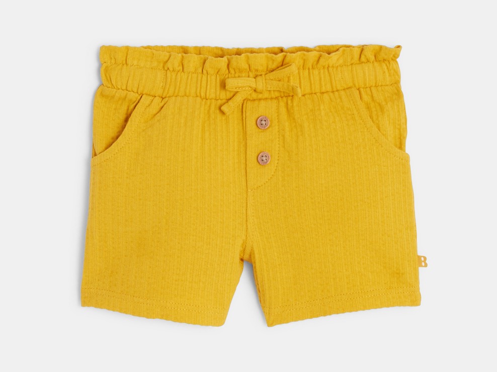 Shorts giallo in cotone fantasia per neonata 1