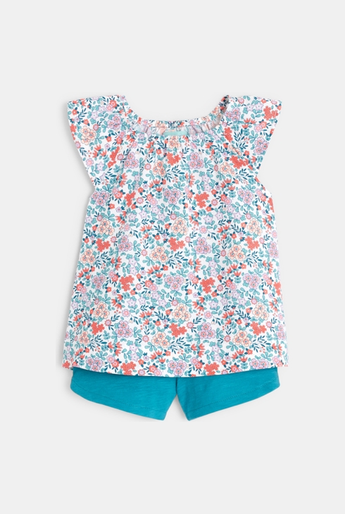 Blouse fleurie et short bleu bébé fille