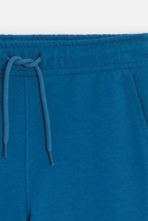 Jogging en molleton light uni bleu Garçon