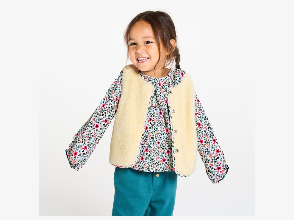 Cárdigan sin mangas reversible sherpa de flores blanco bebé niña 1