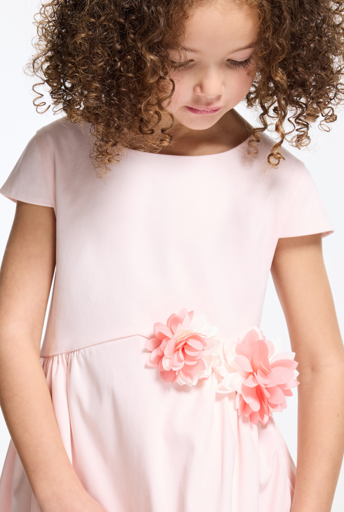 Baby girl's pink dress with textured rose 1