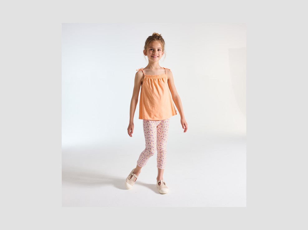 Leggings corti arancio stampati bambina 1