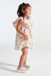 Vestido fluido con volantes palmeras beige bebé niña 4