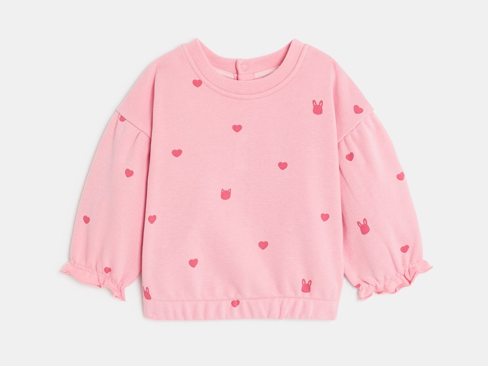 Maglia rosa in tessuto felpato con cuori per neonata 1
