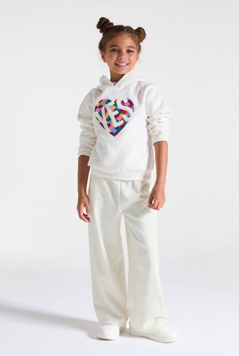 Joggers bianchi in tessuto felpato tinta unita modello largo per bambina 1