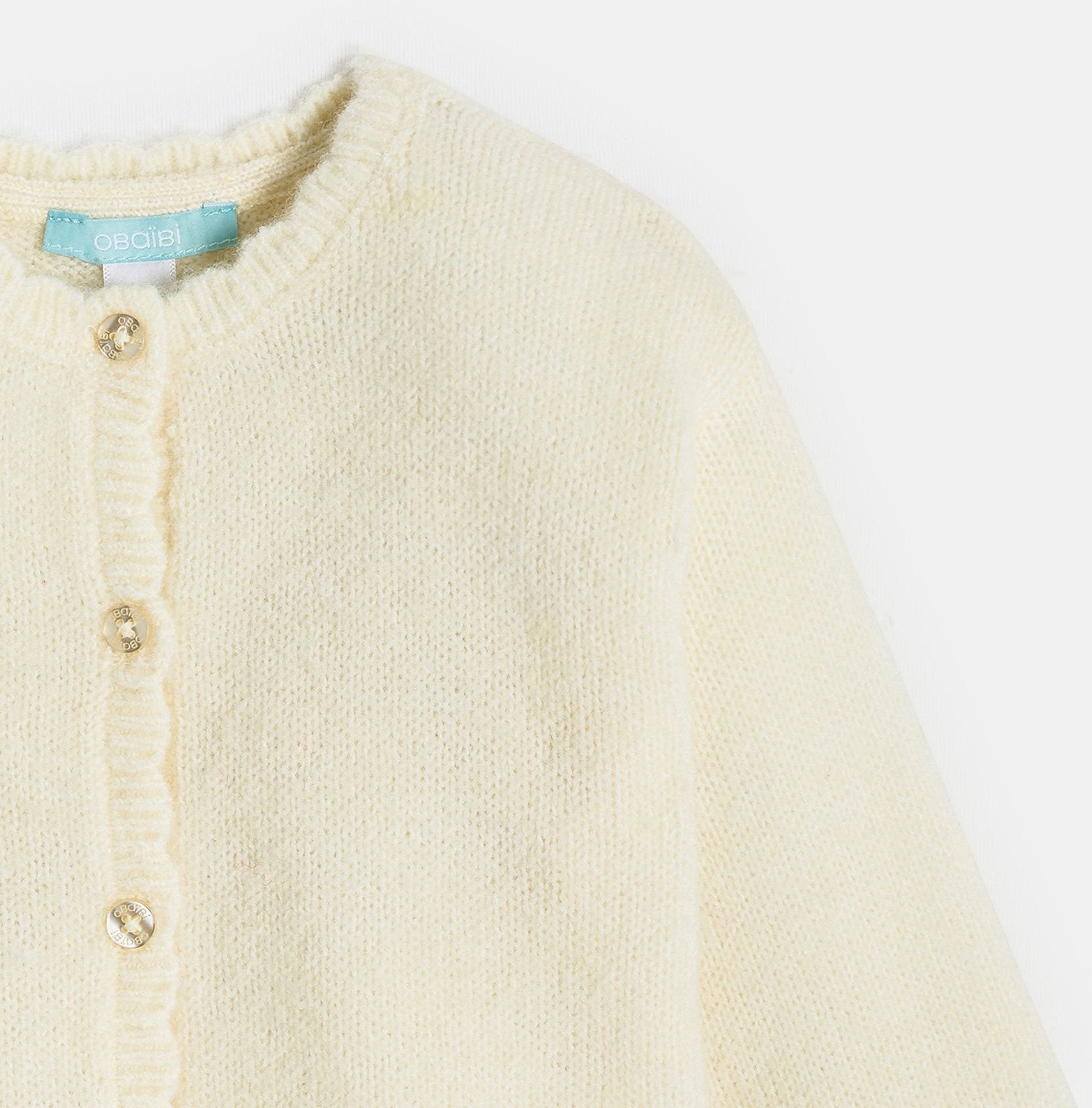 Gilet blanc en maille bébé fille