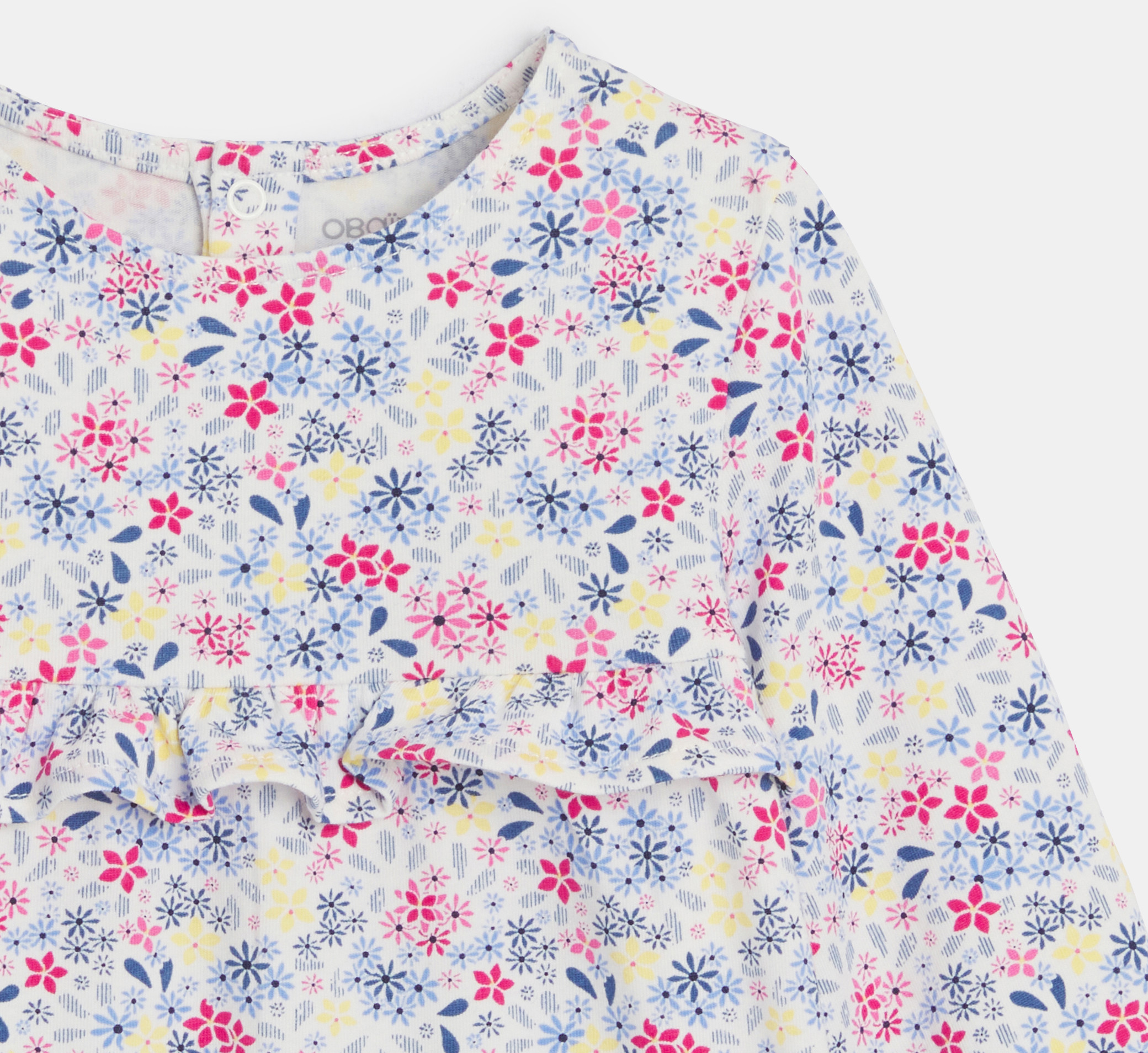 Blusa bianca con motivo floreale e volant per neonata 2