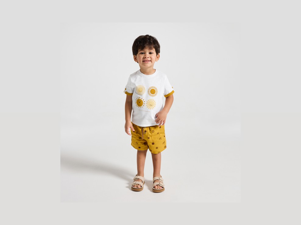 T-shirt gialla con sole neonato 1