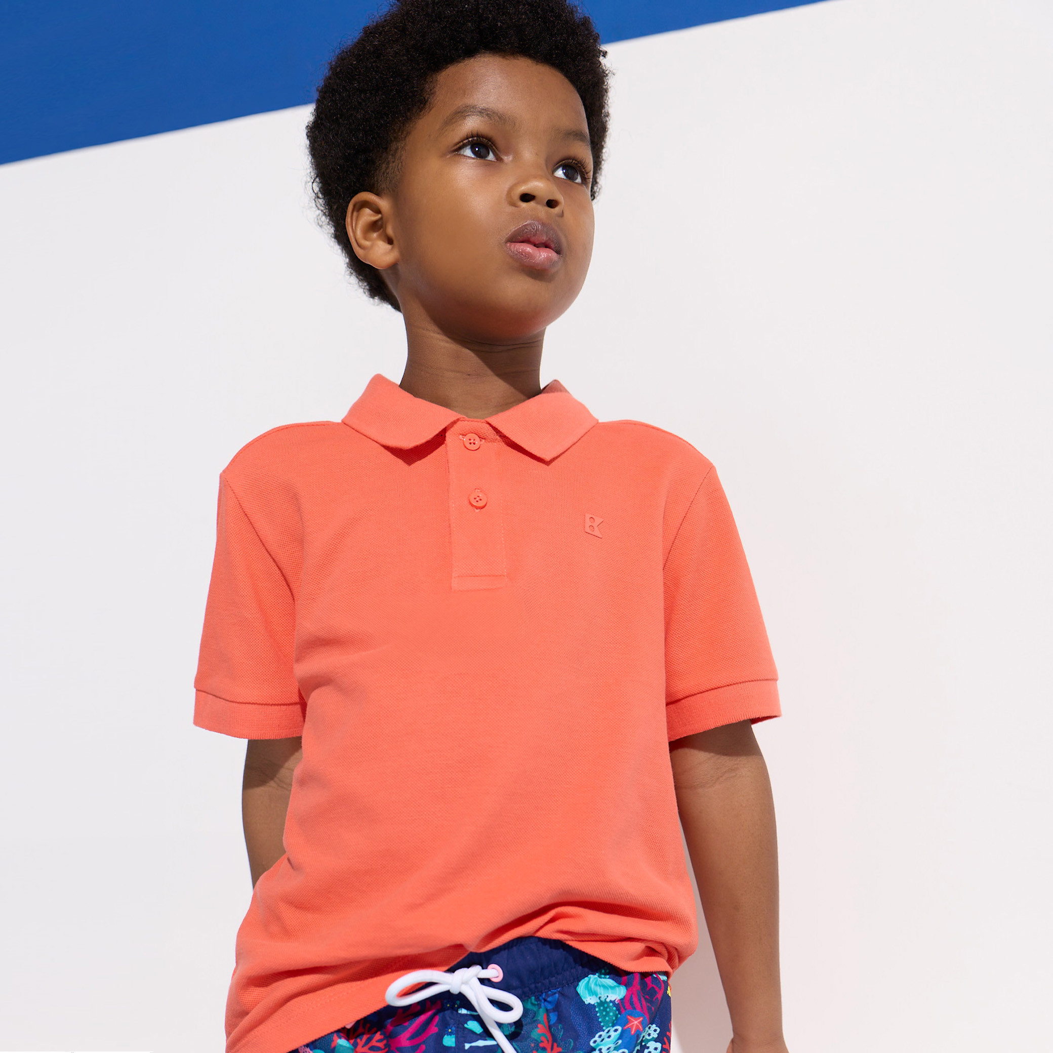 Polo coton piqué bleu marine garçon - Orange paprika