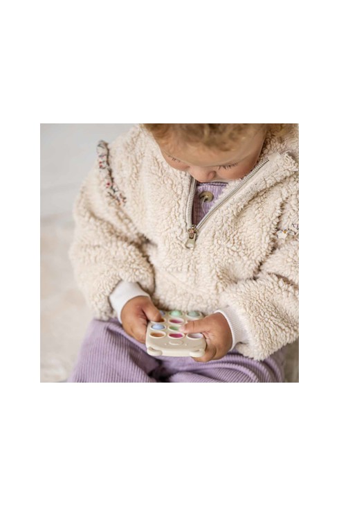 Jouet pop it forme télécommande Nattou